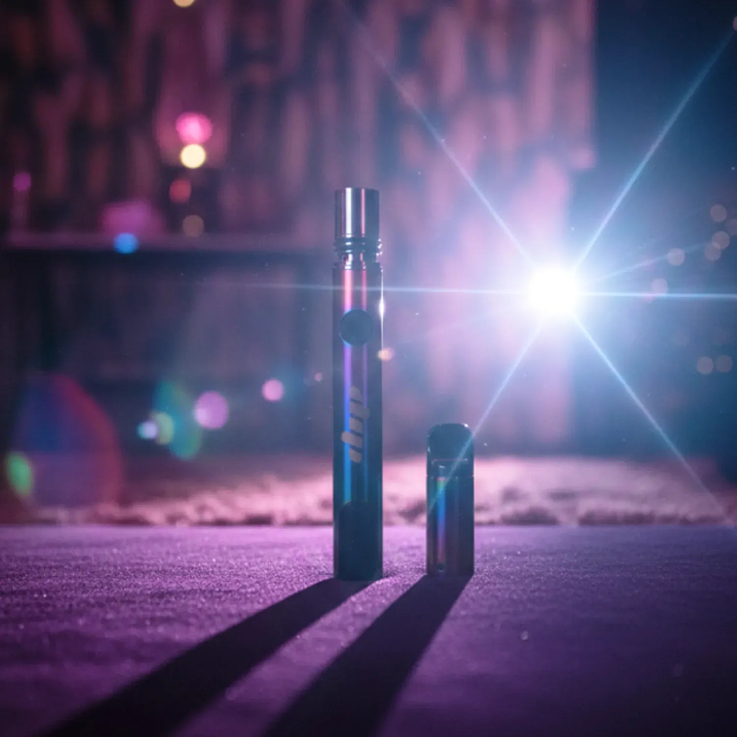 Center-focused, low-angle shot of the red Dip Devices Lunar (Upgraded!) pen and cap standing on a purple-lit surface with a bright starburst light and bokeh background.