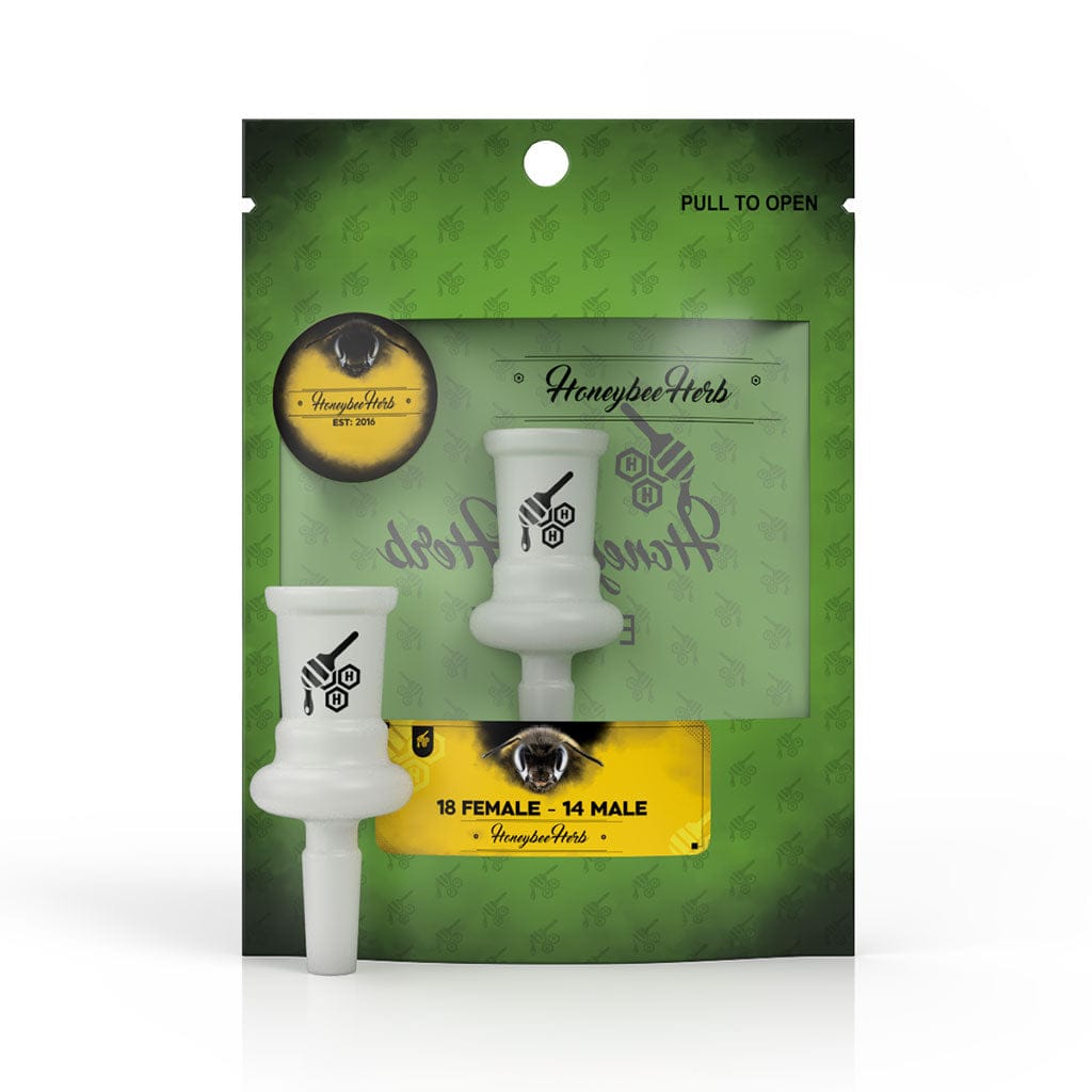Front-facing product shot of the Honeybee Herb Glass Converter Adapter displayed in its green retail pouch, showing the white glass 14F–14F adapter centered against branded backing.