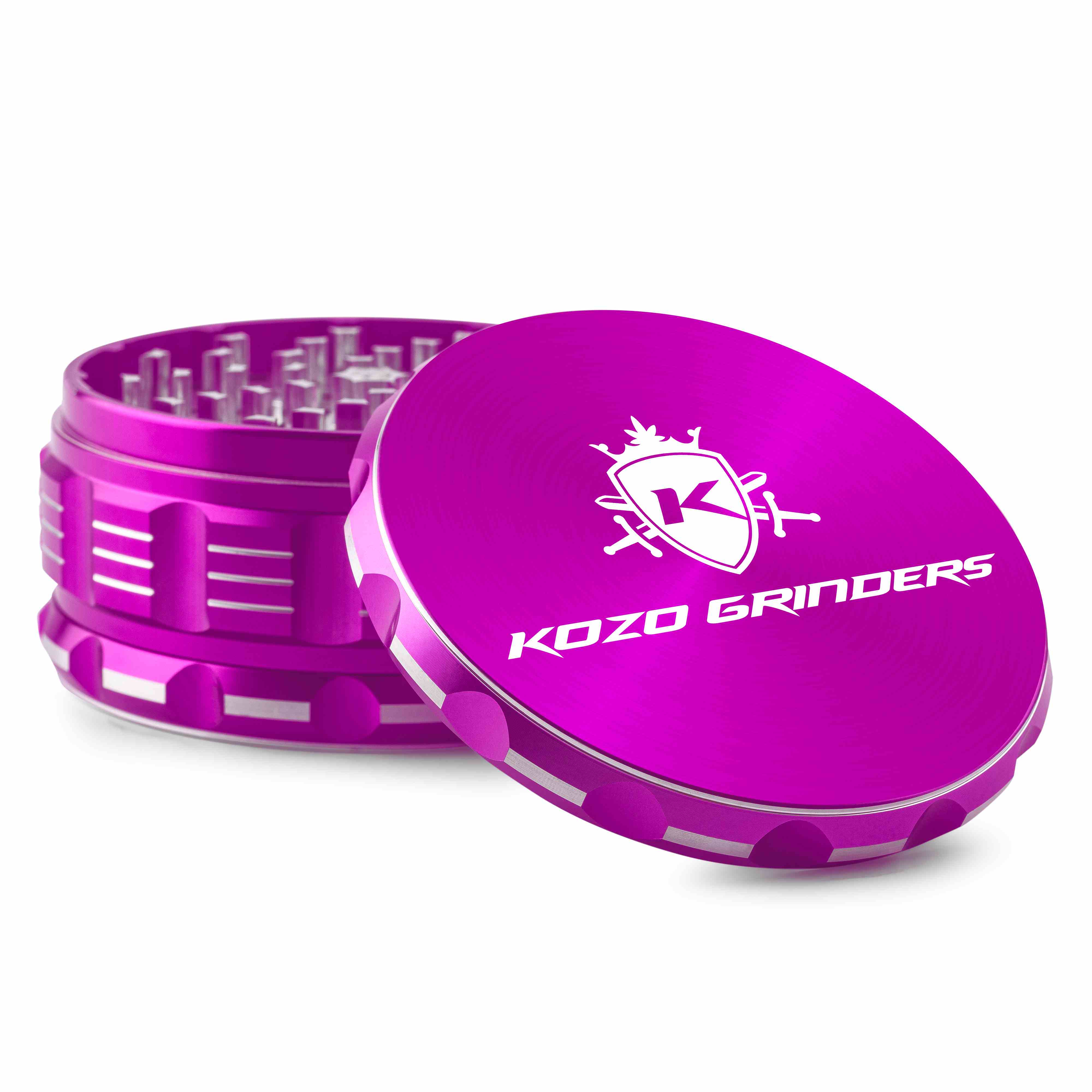Close-up angled view of the bright pink Kozo Grinder 4" showing the textured sides, interior teeth, and branded lid.