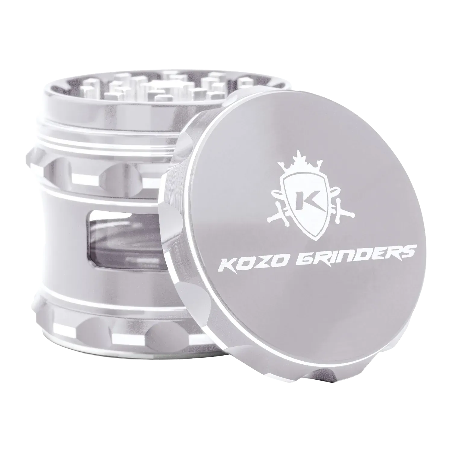 Angled close-up of the metallic Kozo Window 2.5" Grinder showing its textured lid with logo and a side window revealing internal chambers