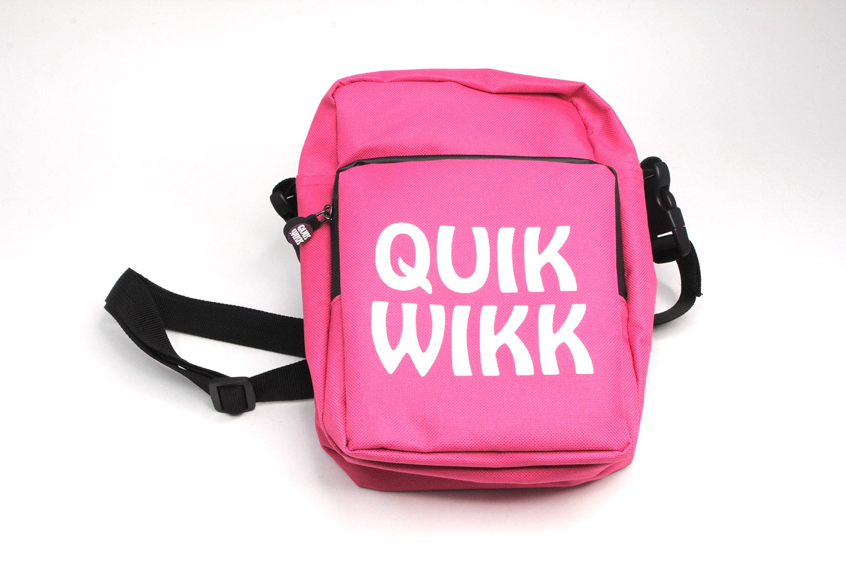 Close-up front view of the hot pink Quik Wikk Shoulder Cross Body Bag with bold white "QUIK WIKK" text and black shoulder strap on a white background.