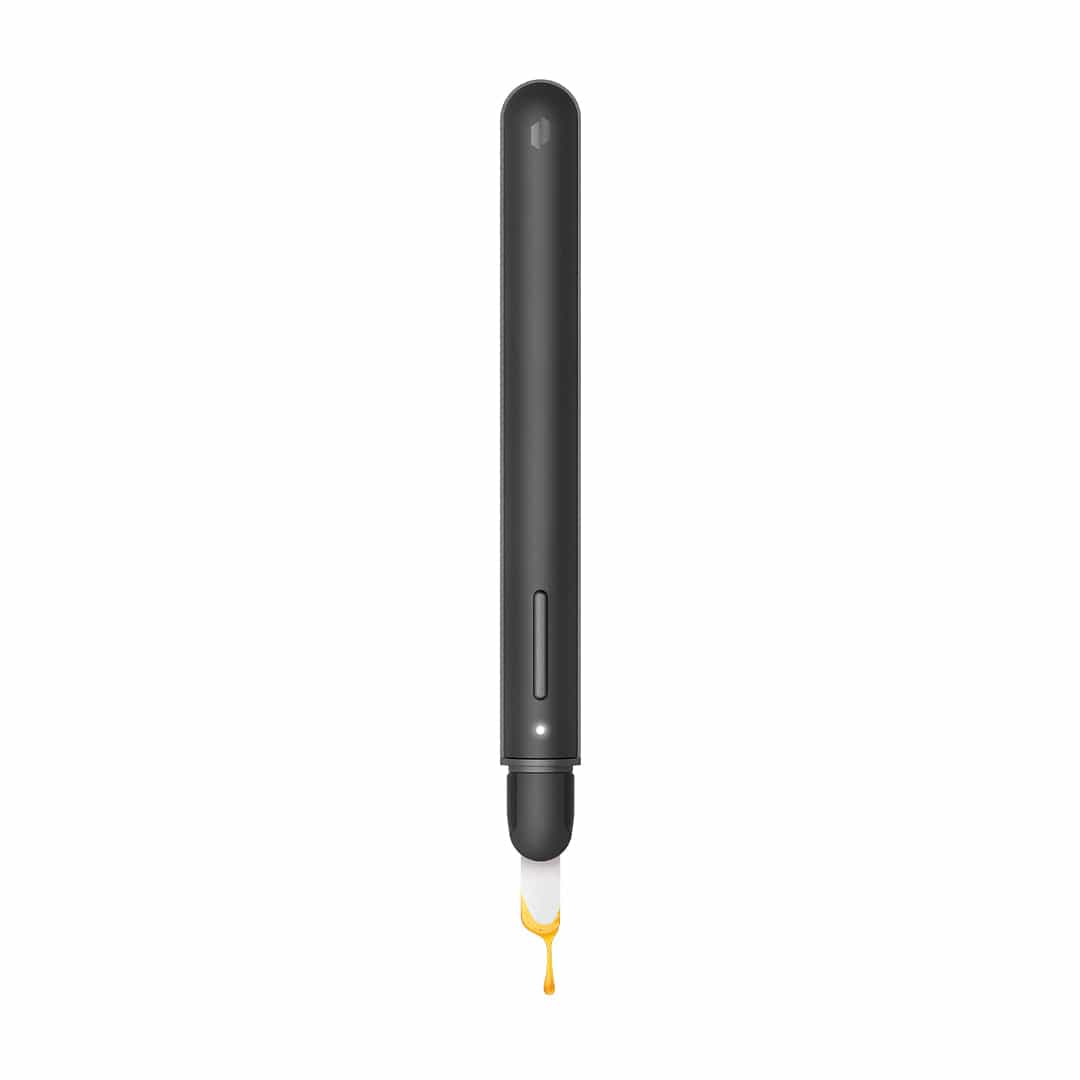 Top-down view of the slim black Puffco New Hot Knife with its heated white tip dripping amber concentrate against a white background.