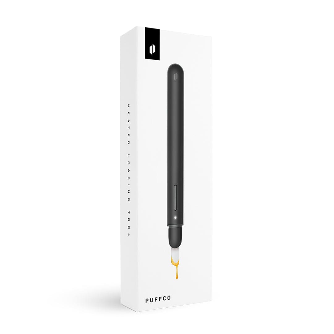 Angled front view of the Puffco New Hot Knife in black on its white retail box, shown with a drip of golden oil below.