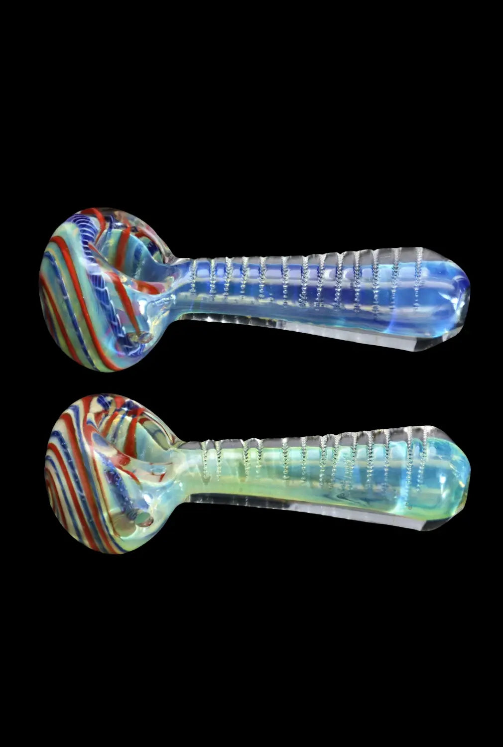 Side view of two mirrored DHC Engraved Fumed Spoon Pipe - 3 in. glass pipes with striped bowls and ribbed translucent stems on a black background