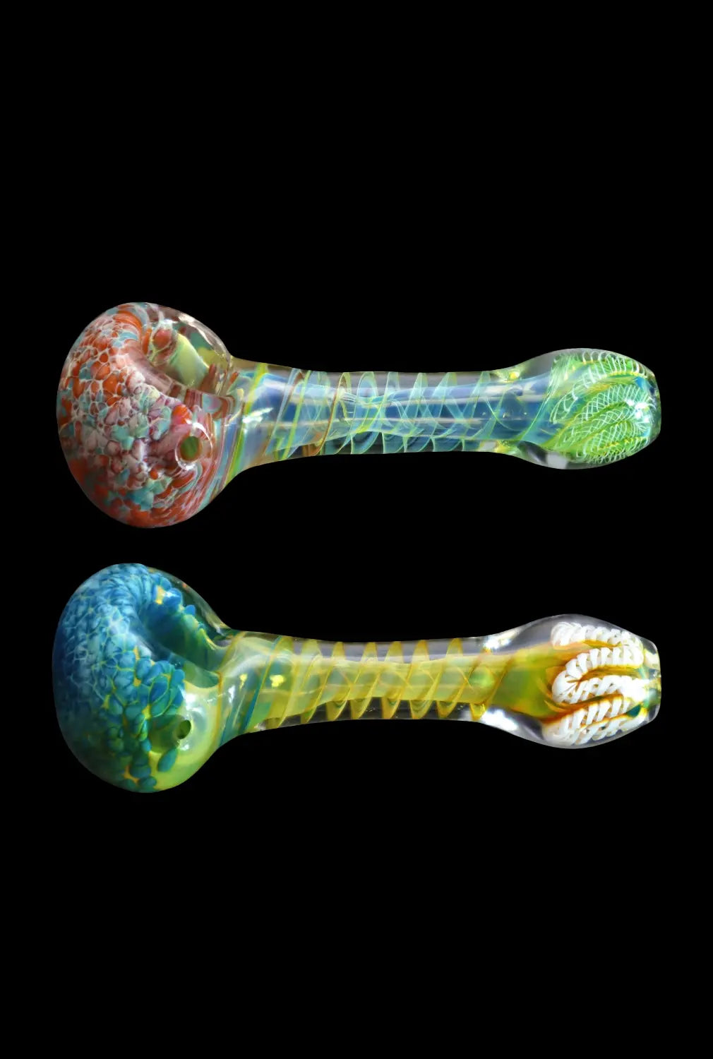 Top-down view of two colorful DHC Twisting Frit Spoon Pipe - 3 in. hand pipes, one red-speckled and one blue-speckled, on a black background