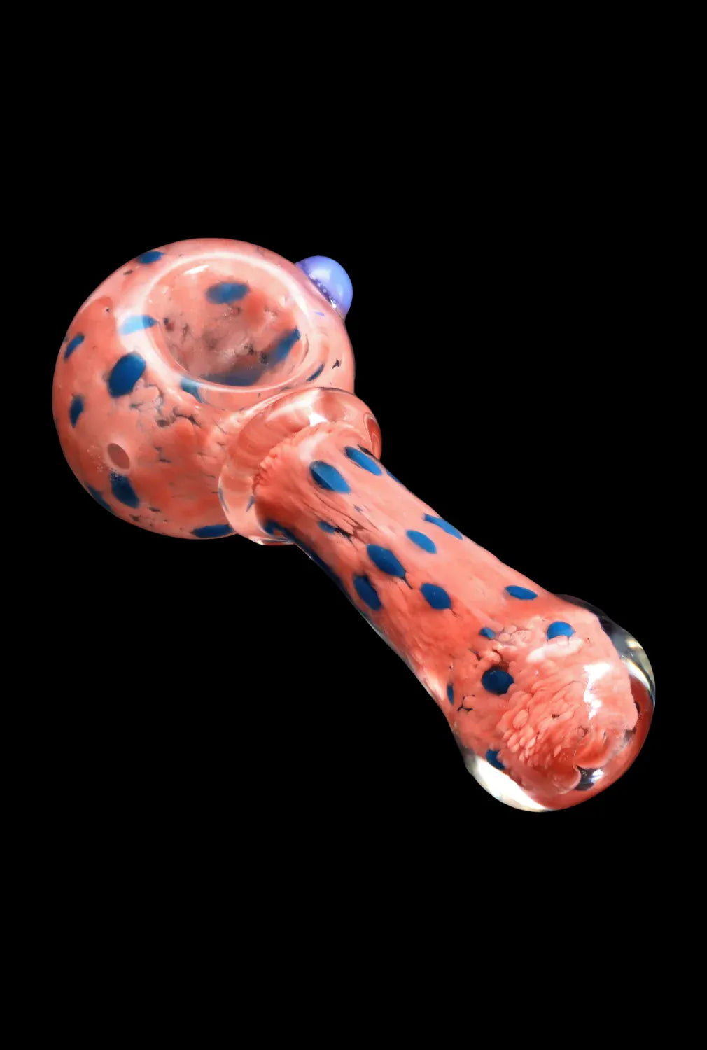 Top-down angled view of the DHC Frit with Twisted Mouthpiece Spoon Pipe - 4 in. showing a pink glass bowl and stem speckled with blue spots against a black background