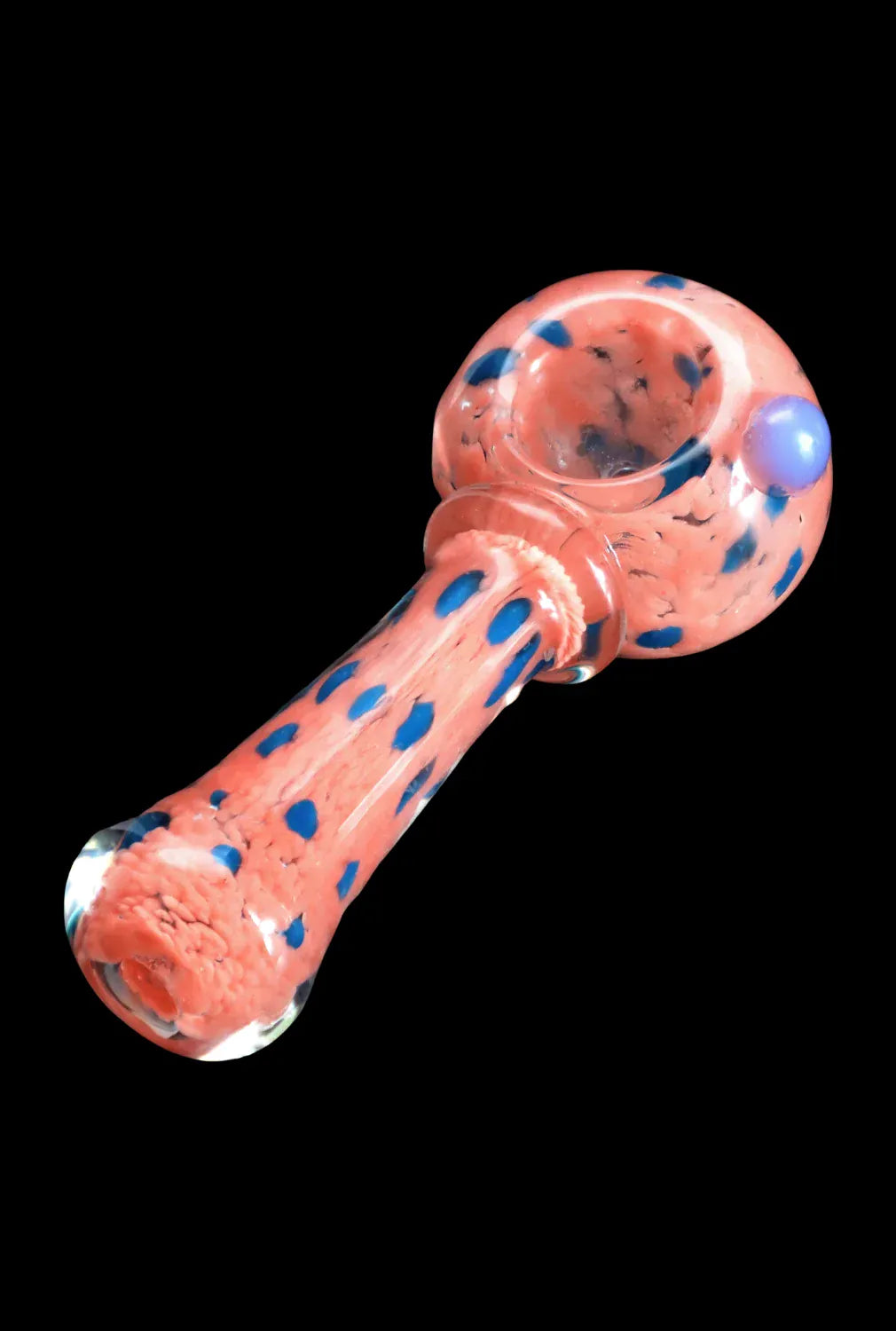 Angled close-up of the DHC Frit with Twisted Mouthpiece Spoon Pipe - 4 in., showing a coral glass body with blue frit spots against a black background