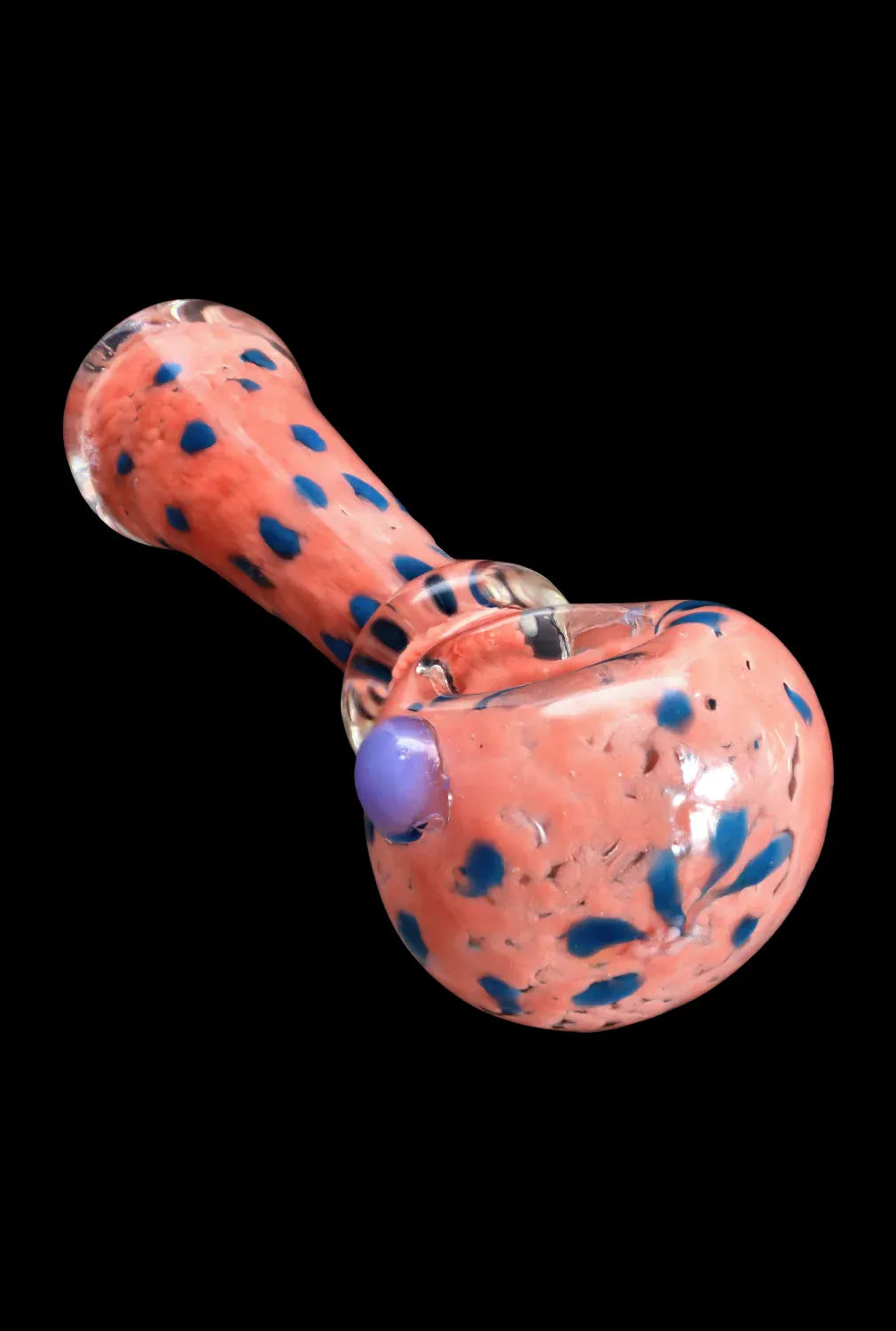Angled close-up of the DHC Frit with Twisted Mouthpiece Spoon Pipe - 4 in. showing a coral glass body with scattered blue frit dots and a purple carb on a black background