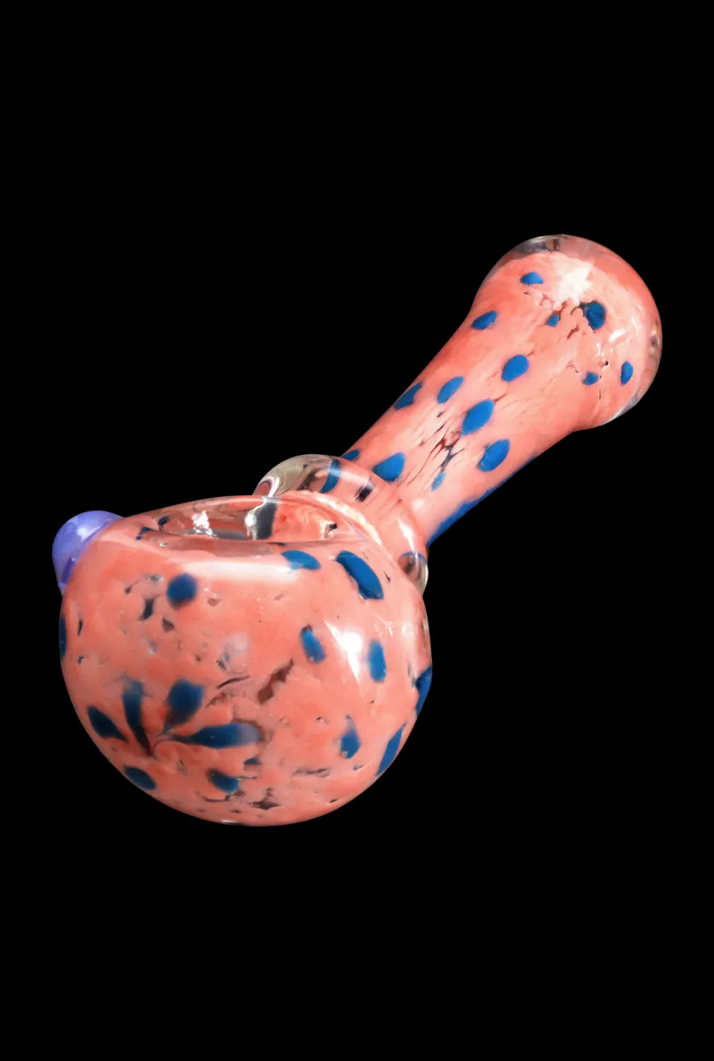 Close-up angled view of the DHC Frit with Twisted Mouthpiece Spoon Pipe - 4 in., showing its pink glass body with scattered blue frit dots against a black background.