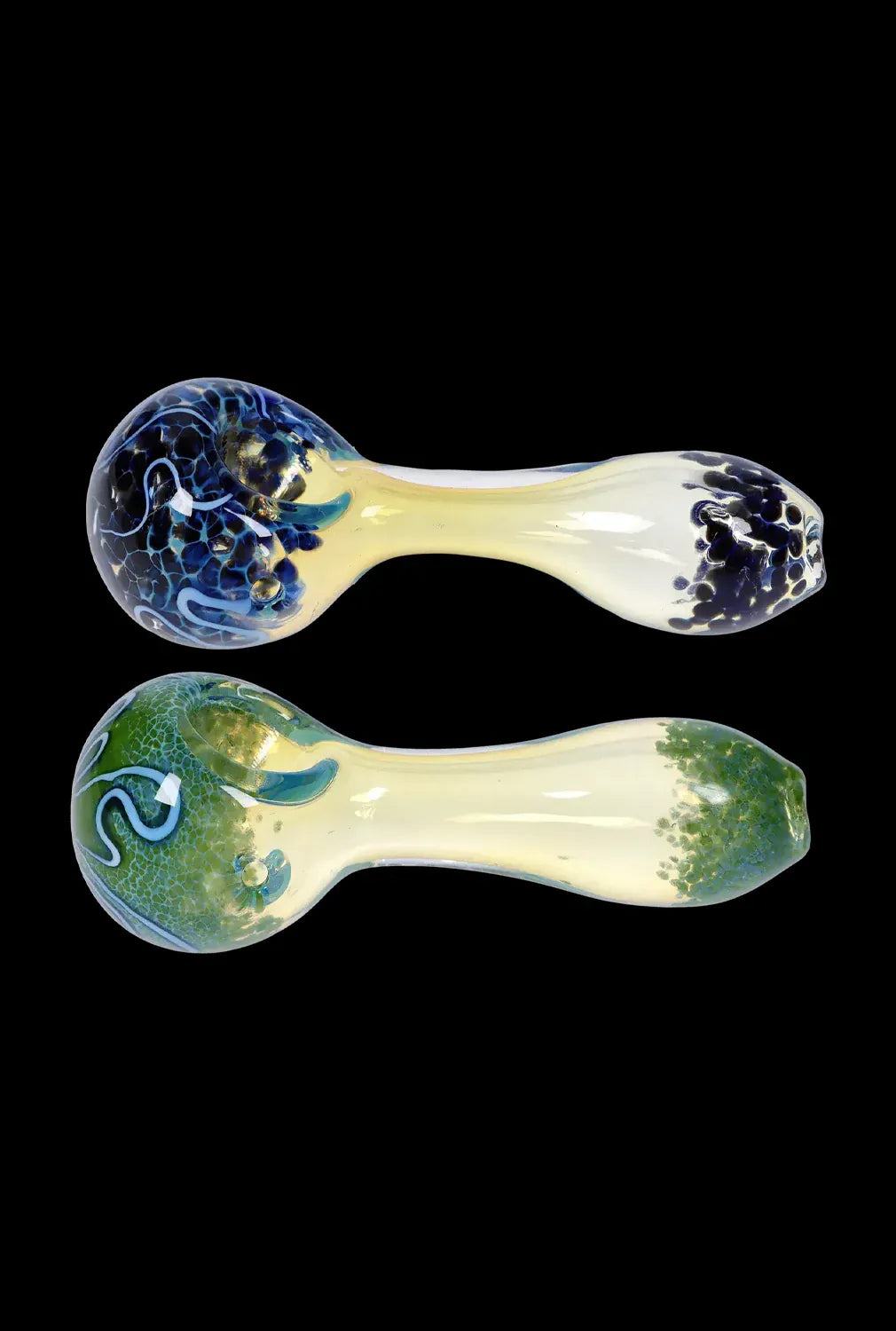 Top-down view of two DHC Frit Fumed with Piping Spoon Pipe - 2.5 in. glass handpipes, one with blue frit and swirls and the other with green frit, shown on a black background.