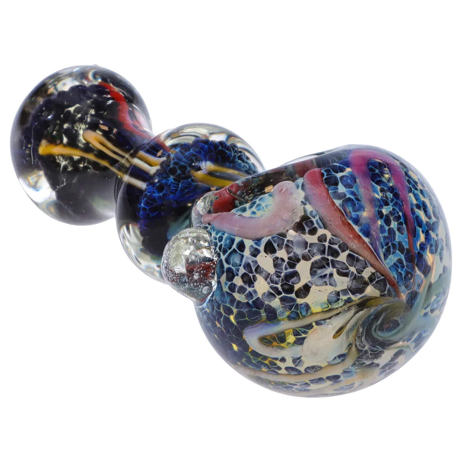 Angled close-up of the DHC Fancy Frit Spoon Pipe - 3.5 in. showing multicolored frit patterns, swirls, and glass marbles under bright studio lighting