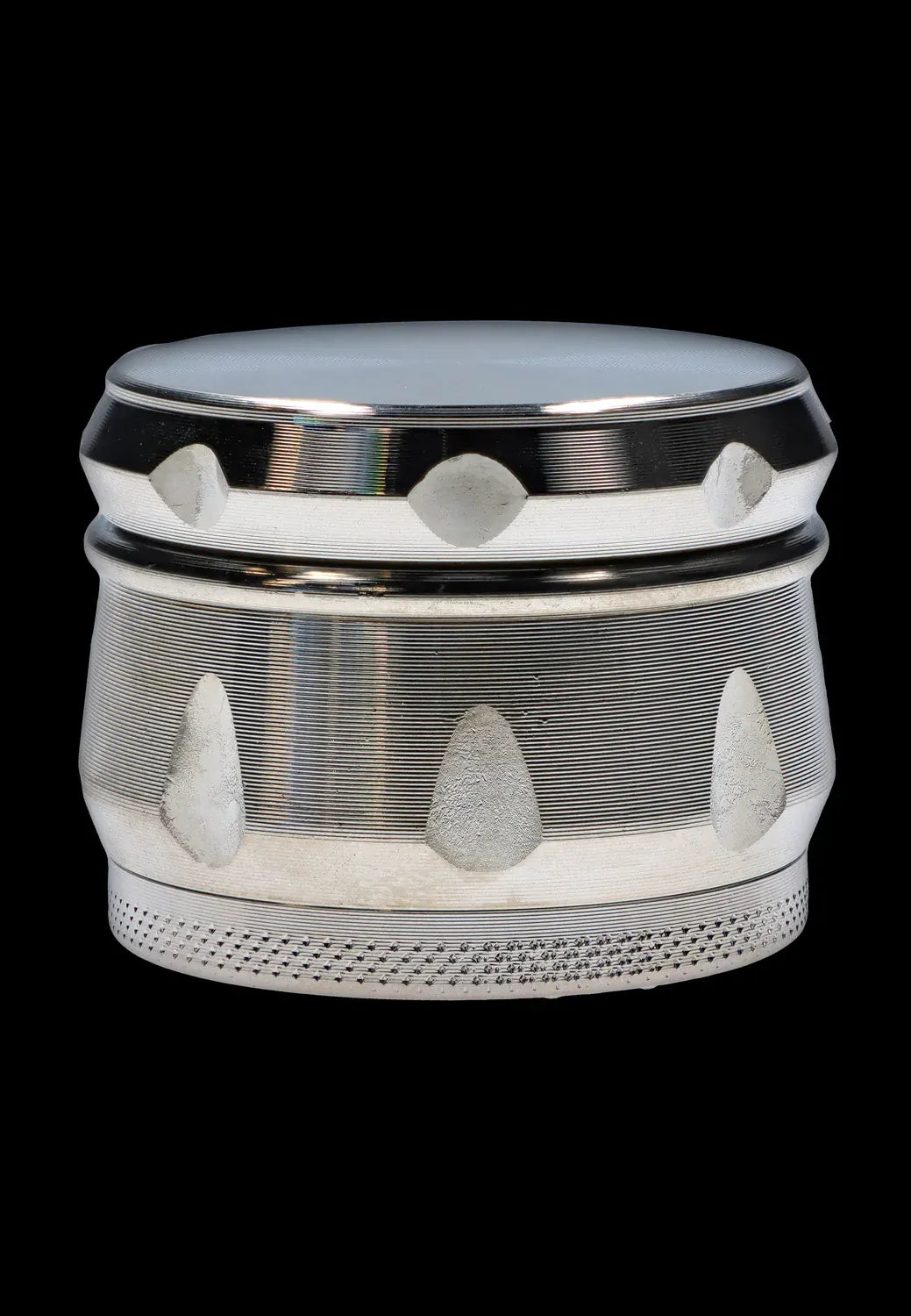 Close-up front view of the metallic DHC Grooved 3-Stage Grinder - 62mm showing its reflective grooved bands and teardrop cutouts against a black background