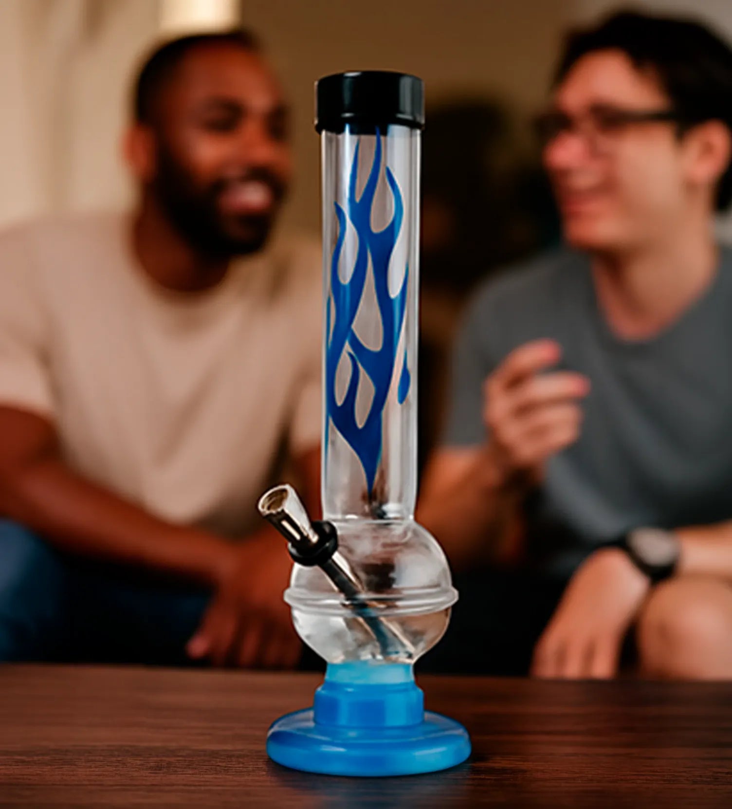 Close-up front view of the JM Plastics Flame Bubble Base Acrylic Bong - 12 in. showing a clear tube with blue flame decals and a blue base.