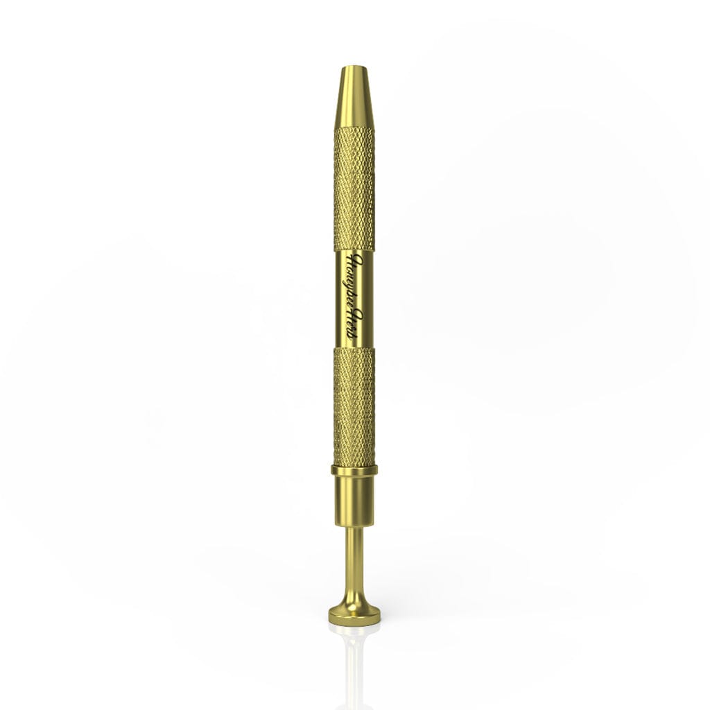 Center-frontal view of a metallic gold Honeybee Herb Dab Claw standing upright on a white background, showing textured grips and engraved branding along the shaft.