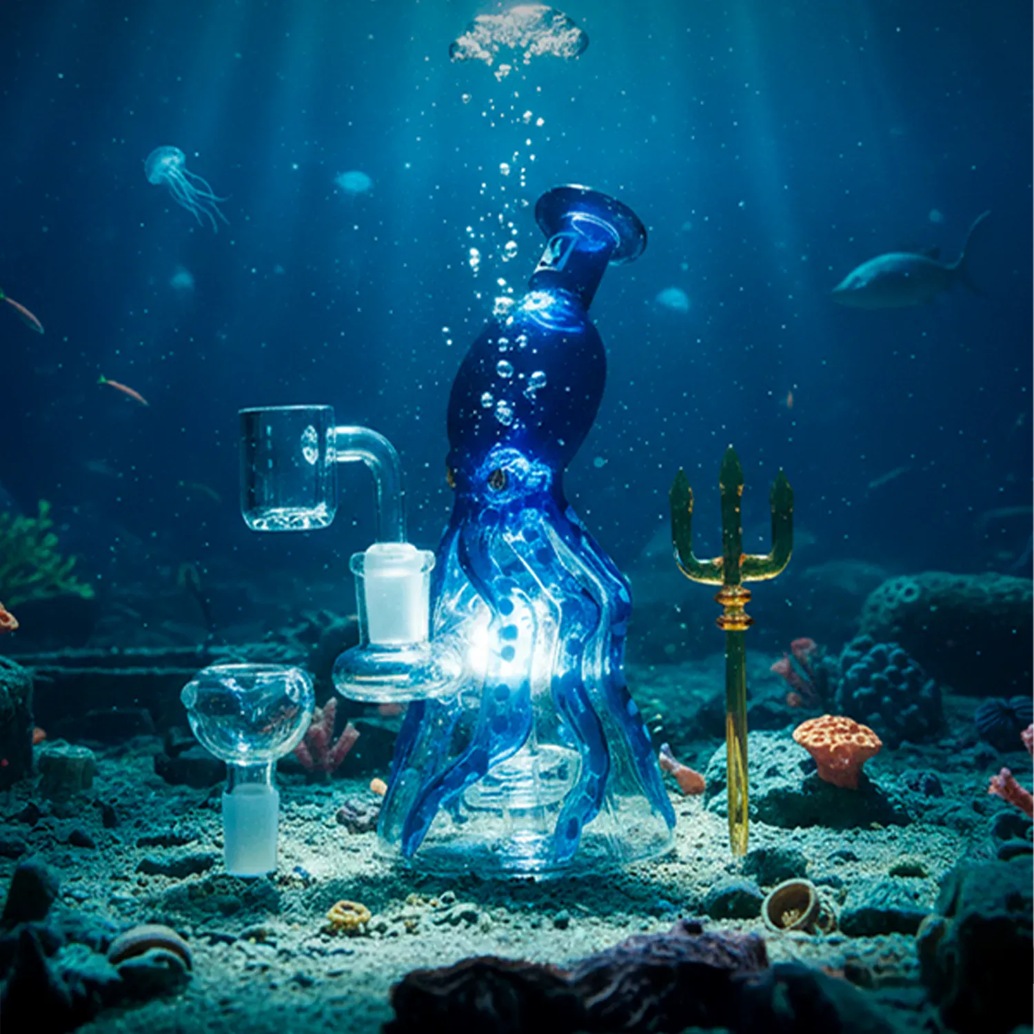Underwater scene showing the "Deep Sea Adventure" Smoking Box displayed as a blue octopus-shaped glass piece on a sandy seafloor with bubbles, jellyfish, and a gold trident nearby.