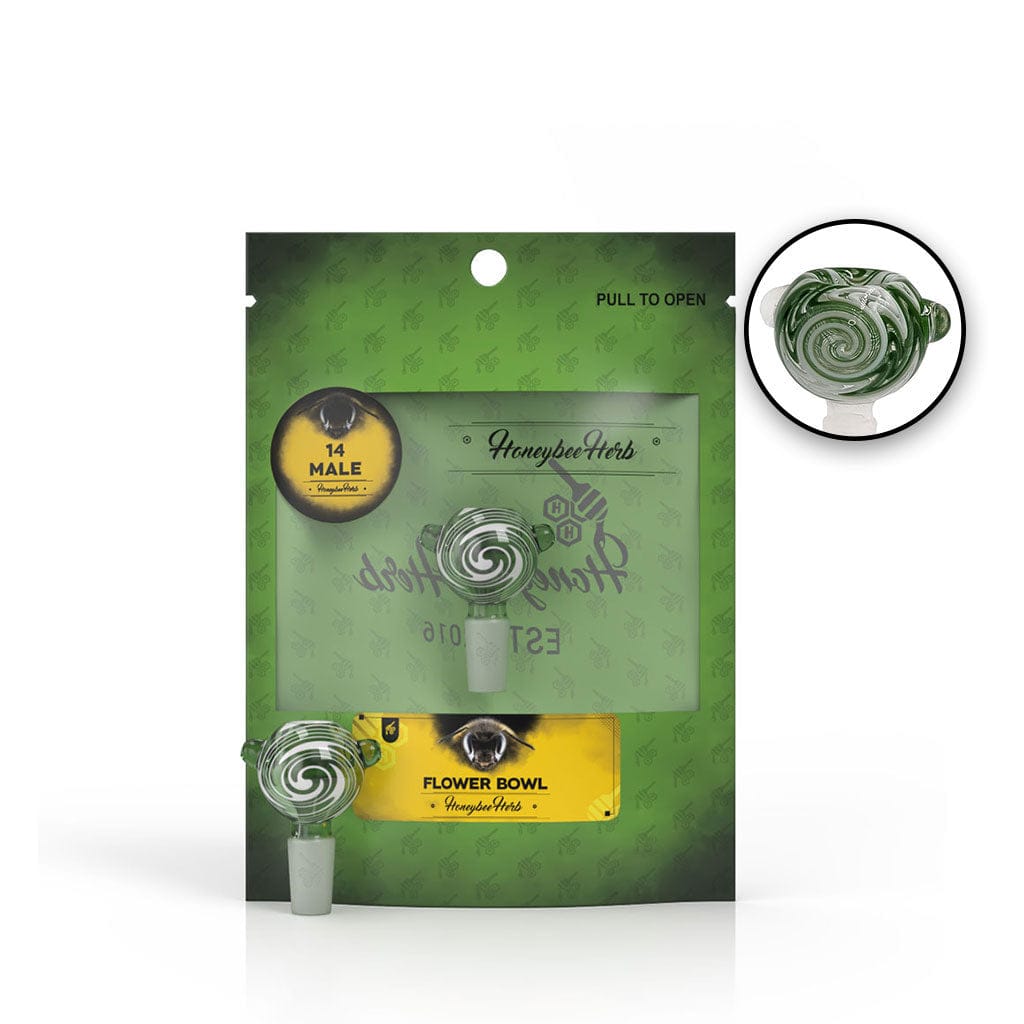 Front-facing shot of the Honeybee Herb Glass Flower Bowl (Fb-10) in its green branded pouch, showing the swirled green glass bowl through a clear window.