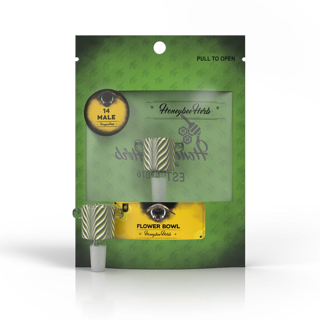 Front-facing shot of the Honeybee Herb Glass Flower Bowl (Fb-9) in its green retail pouch, showing the striped glass bowl through a clear window.