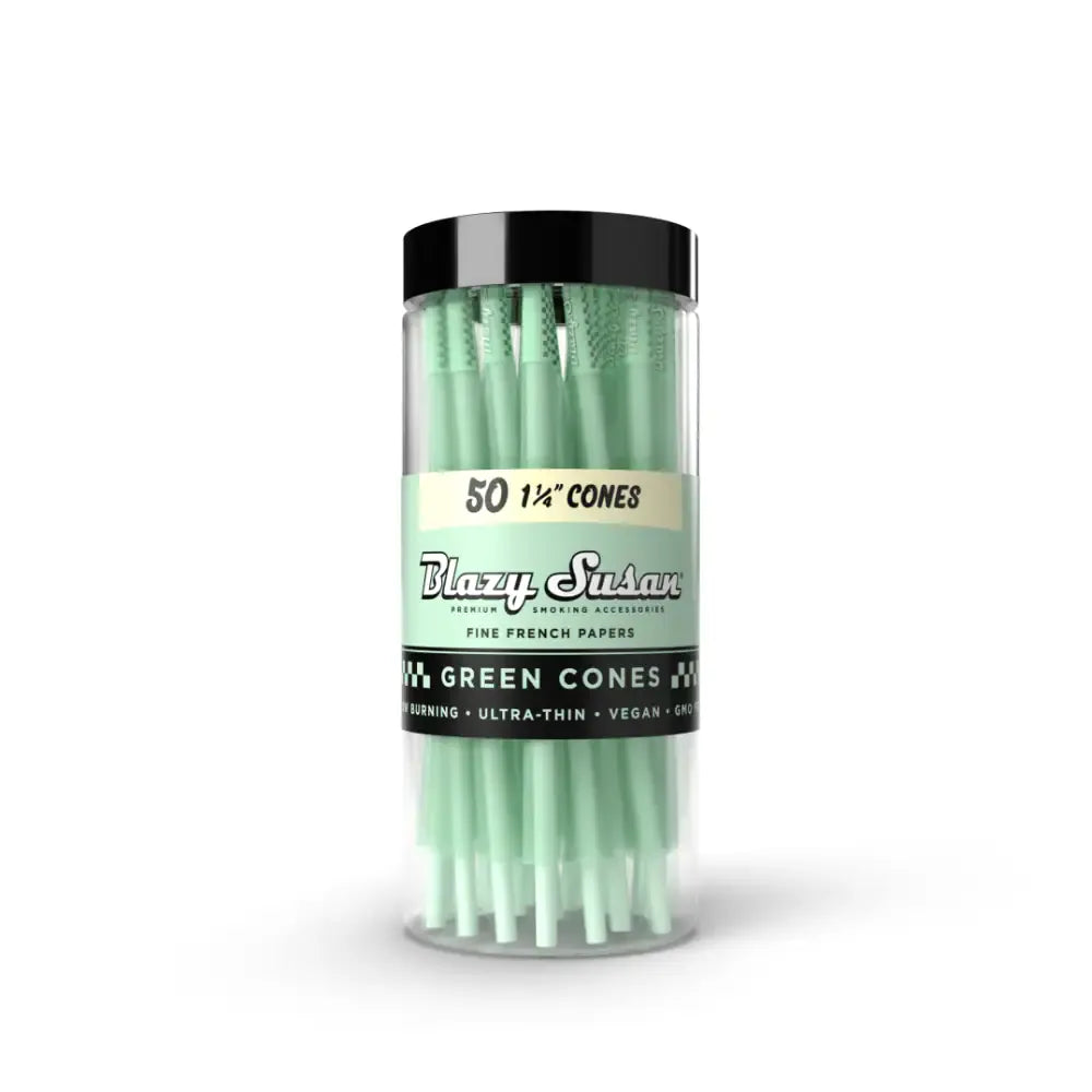 Centered front view of a clear jar of Blazy Susan Green Cones showing mint-green shorty cones and a black lid against white.