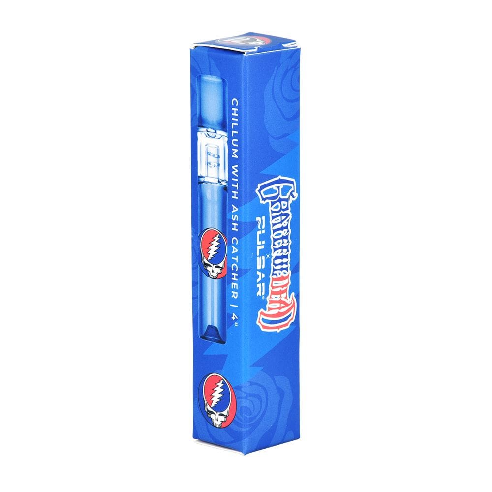 Tall angled view of the Grateful Dead X Pulsar Glass Chillum | Built-In Ash Catcher | 4" in blue retail box showing the clear chillum peek-through and skull logo.