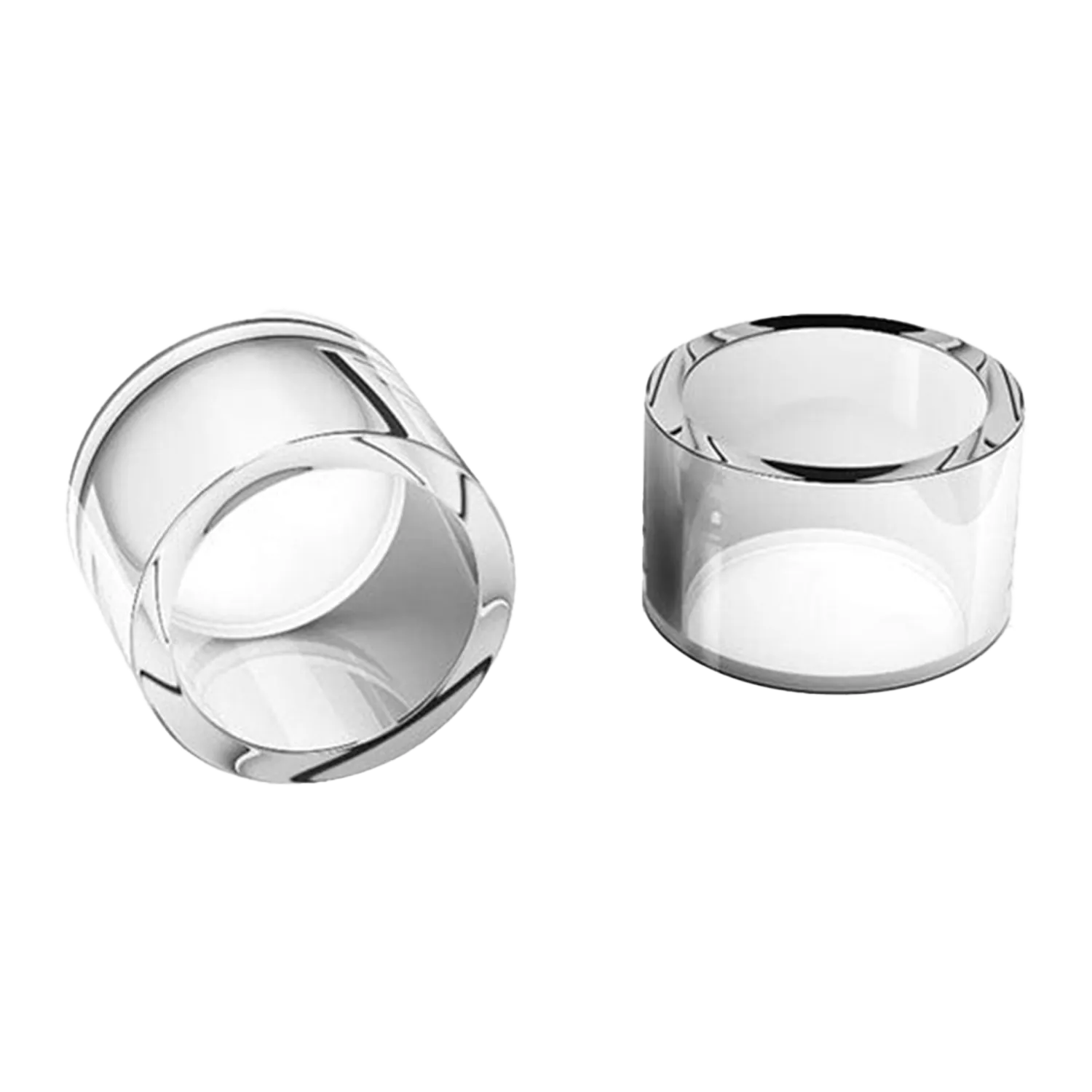 Two clear glass cups lie on a white background, one upright and one on its side, showing the smooth rim of the Honey & Milk Cups