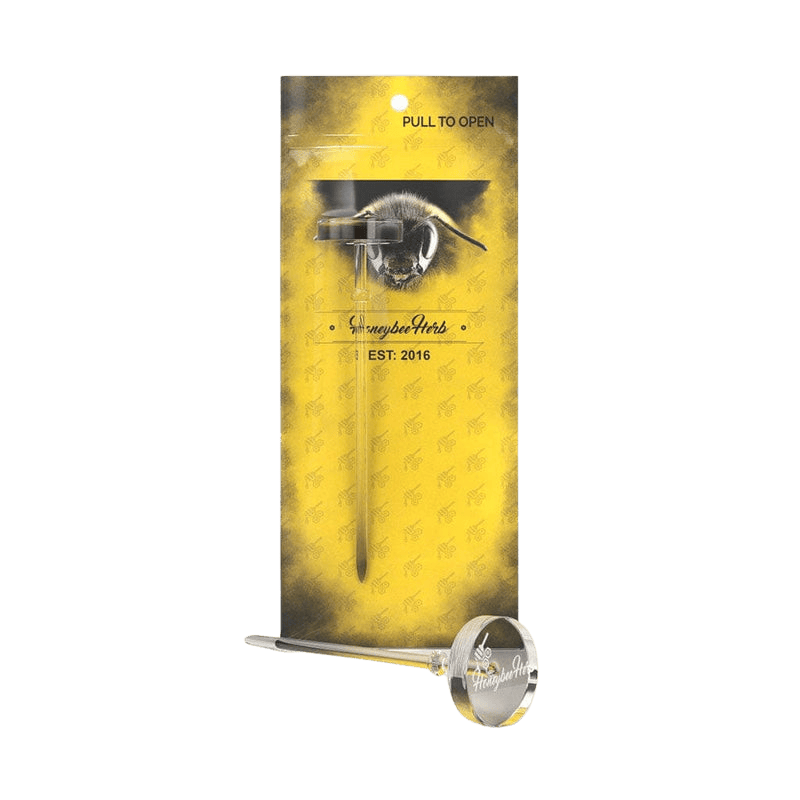 Front view of the Honeybee Herb Flat Top Dabber & Carb Cap Tool against its yellow branded backing with a bee graphic.