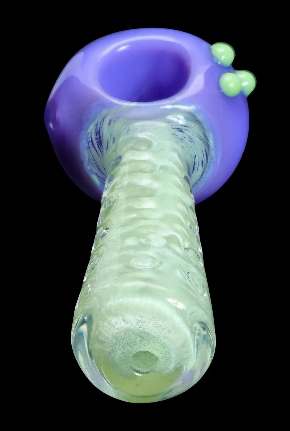 Close-up angled view of the DHC Fancy Stem Spoon Pipe - 4.5 in., showing a purple bowl with green glass stem and three small knobs.