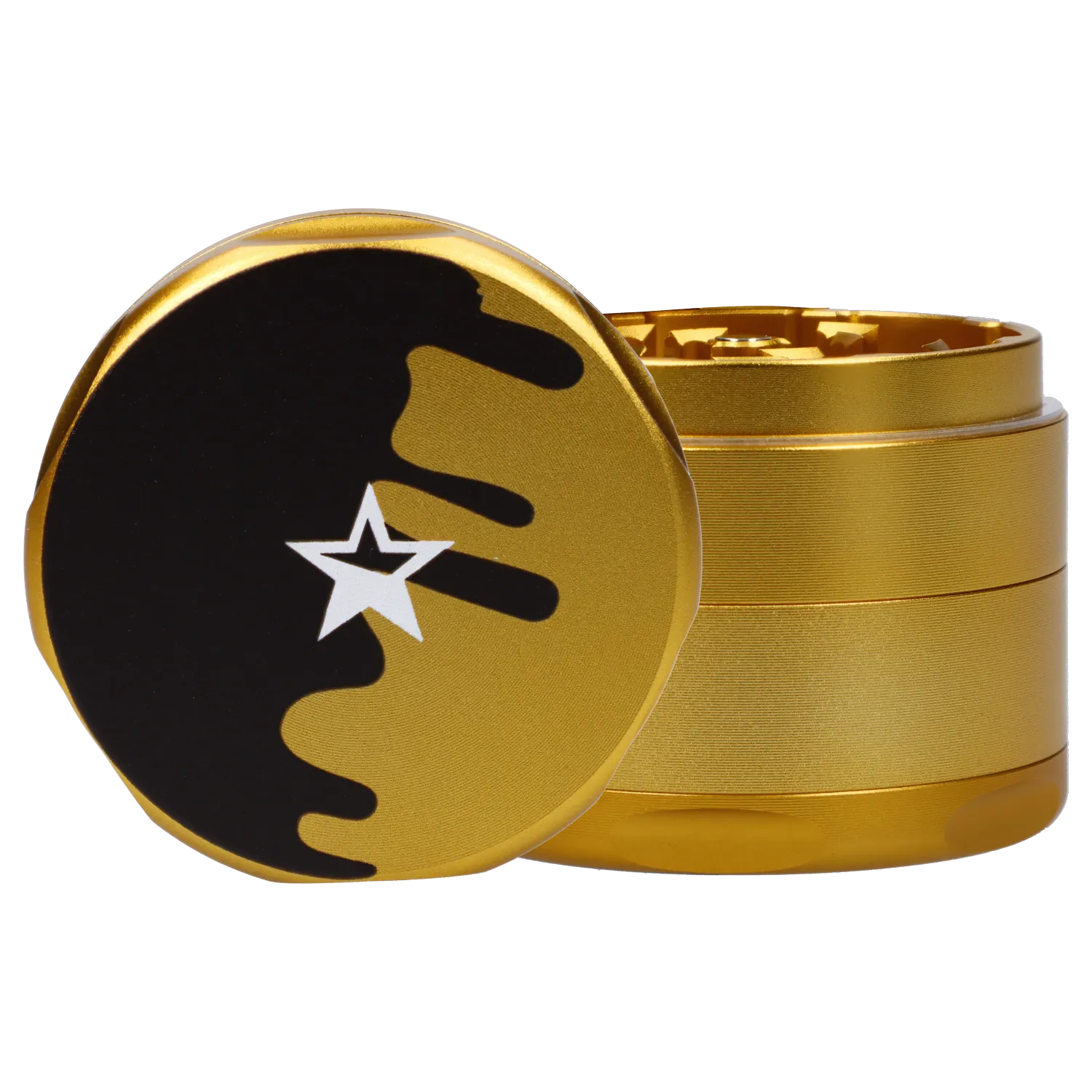 Close-up front view of the gold Famous X Surrender Aluminum 3 Stage Grinder-Gold showing its black drip-and-star logo on the lid and stacked textured chambers.