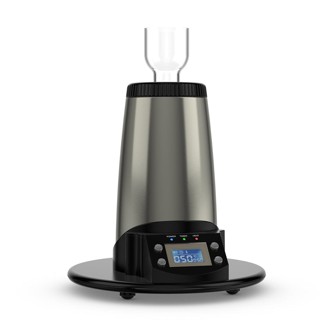 Front-facing view of the Arizer V-Tower Desktop Vaporizer showing its brushed metal tower, digital control panel at the base, and clear glass mouthpiece against a white background