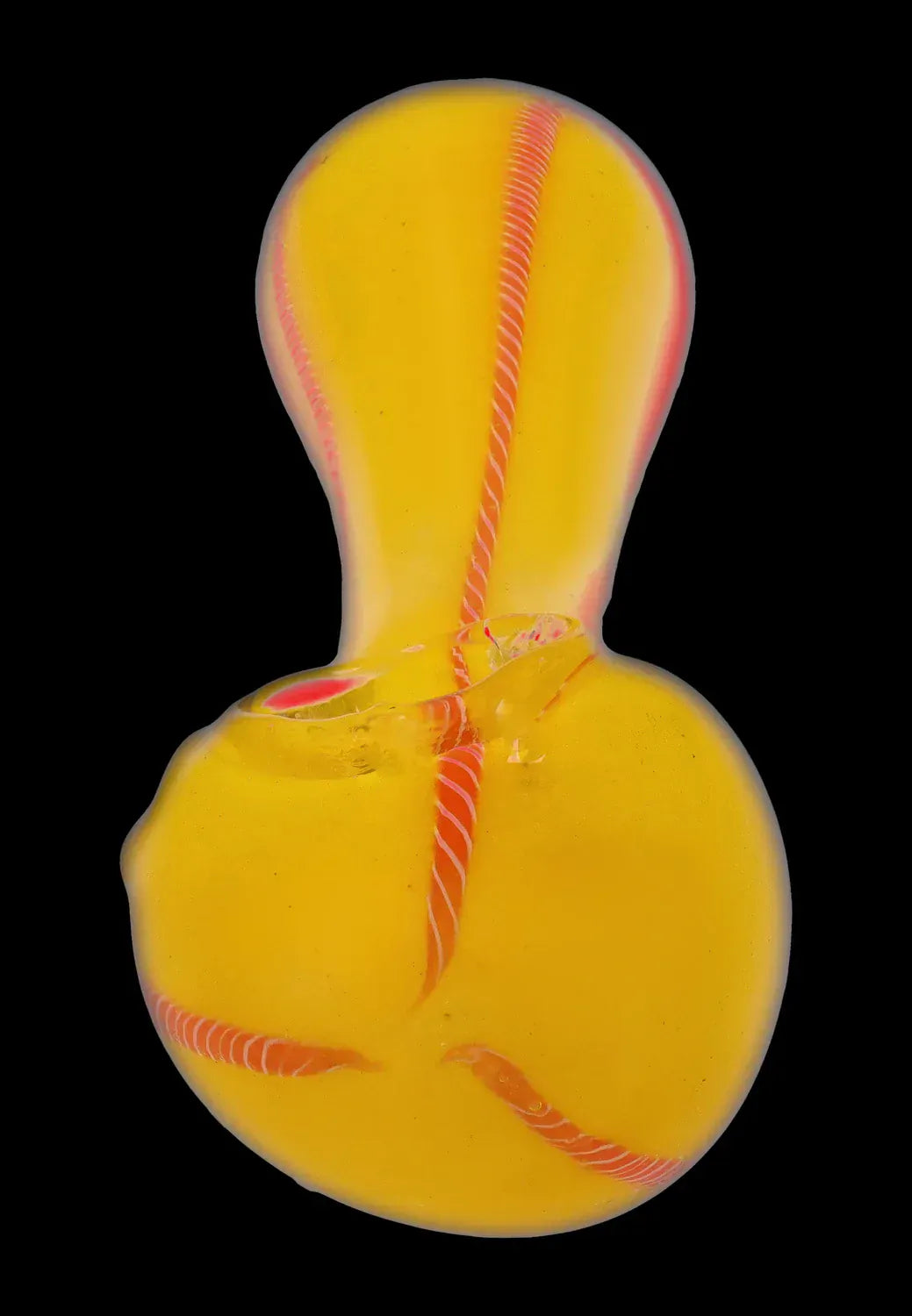 Top-down close-up of the DHC Frit Glass with Rasta Line Spoon Pipe - 4.5 in., showing a yellow glass body with twisted red-orange rasta lines against a black background