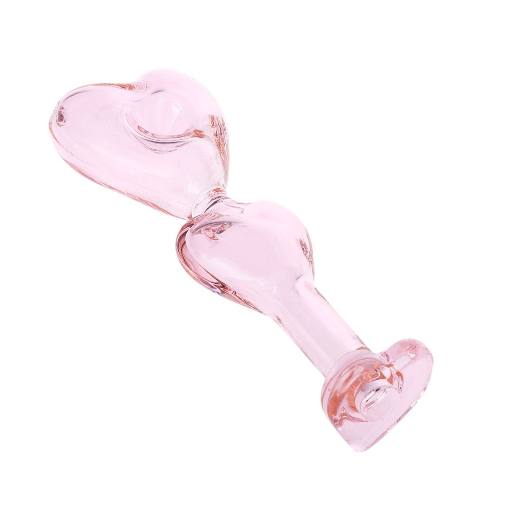 Diagonal overhead view of the Double Love Glass Hand Pipe - 5.5" showing its translucent pink double-heart bowls and stem on a white background