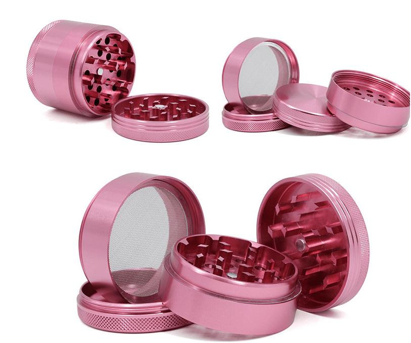 Top-down view of a disassembled pink 4-Piece Aluminum Grinder showing its four threaded chambers, magnetic center, and fine mesh screen.