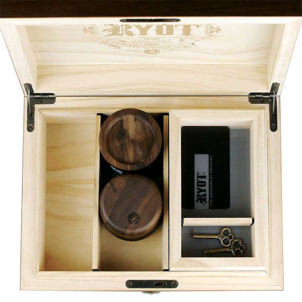 Top-down view of the open Ryot Humidor Walnut Combo Box showing two round walnut containers in the left compartment and a black accessory and brass keys in the right.