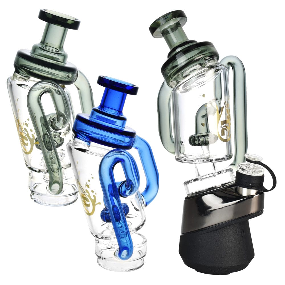 Three-quarter view of three Pulsar Puffco Peak/Pro Recycler Attachment #2 -6.75"/Clrs Vry glass recyclers, the center one in blue and two greenish clear units arranged against a white background.