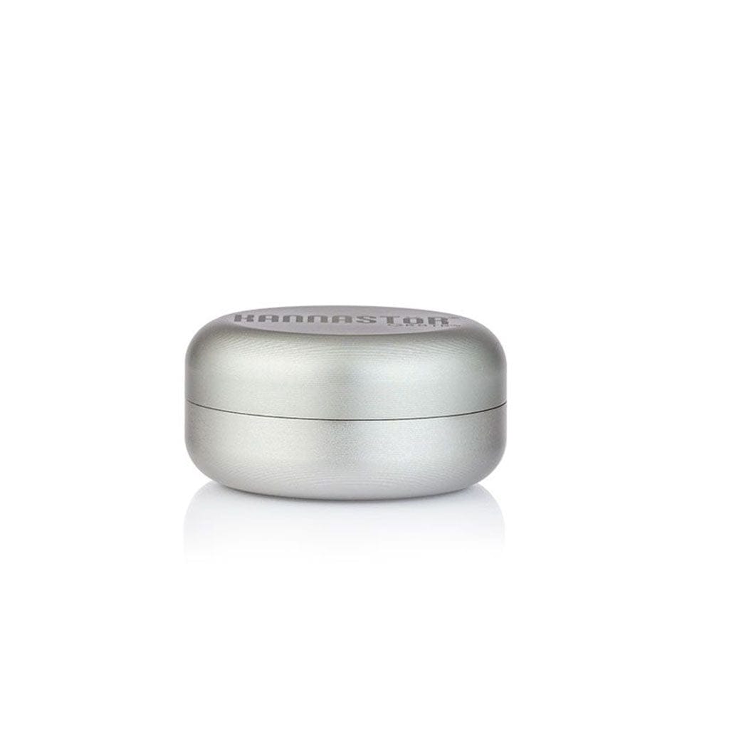 Centered front view of the silver Ryot Gr8Tr Solid Body Grinder resting on a reflective white surface, photographed against a plain white background