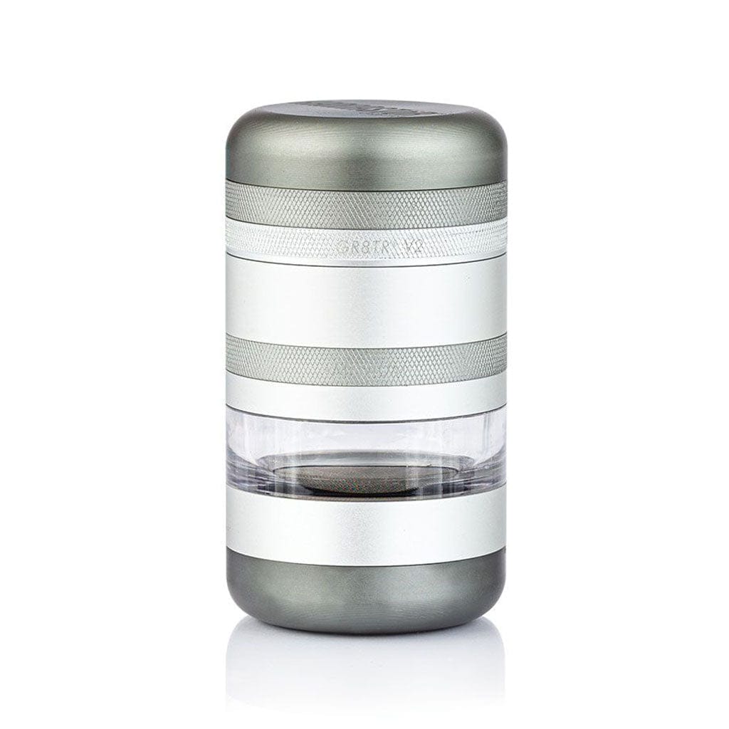 Centered front view of a silver Ryot Gr8Tr Jar Body Grinder with knurled bands and a clear middle chamber on a white background