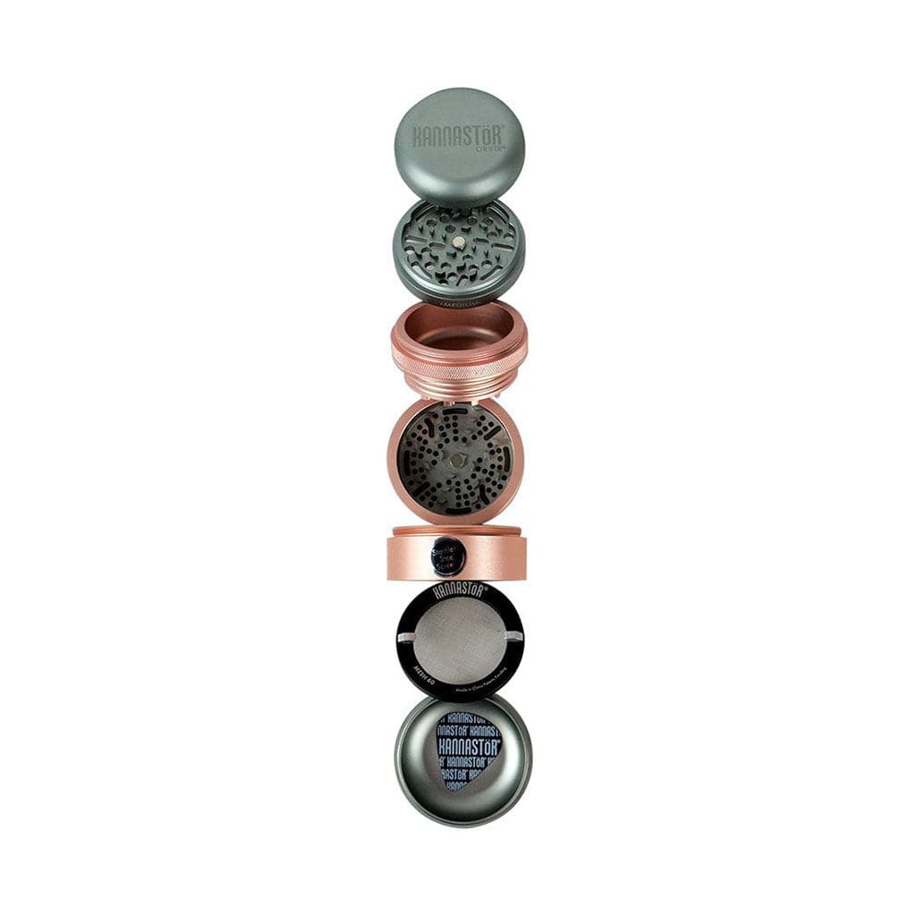 Top-down view of the Ryot Gr8Tr Solid Body Grinder disassembled into its stacked metal chambers and screens against a white background