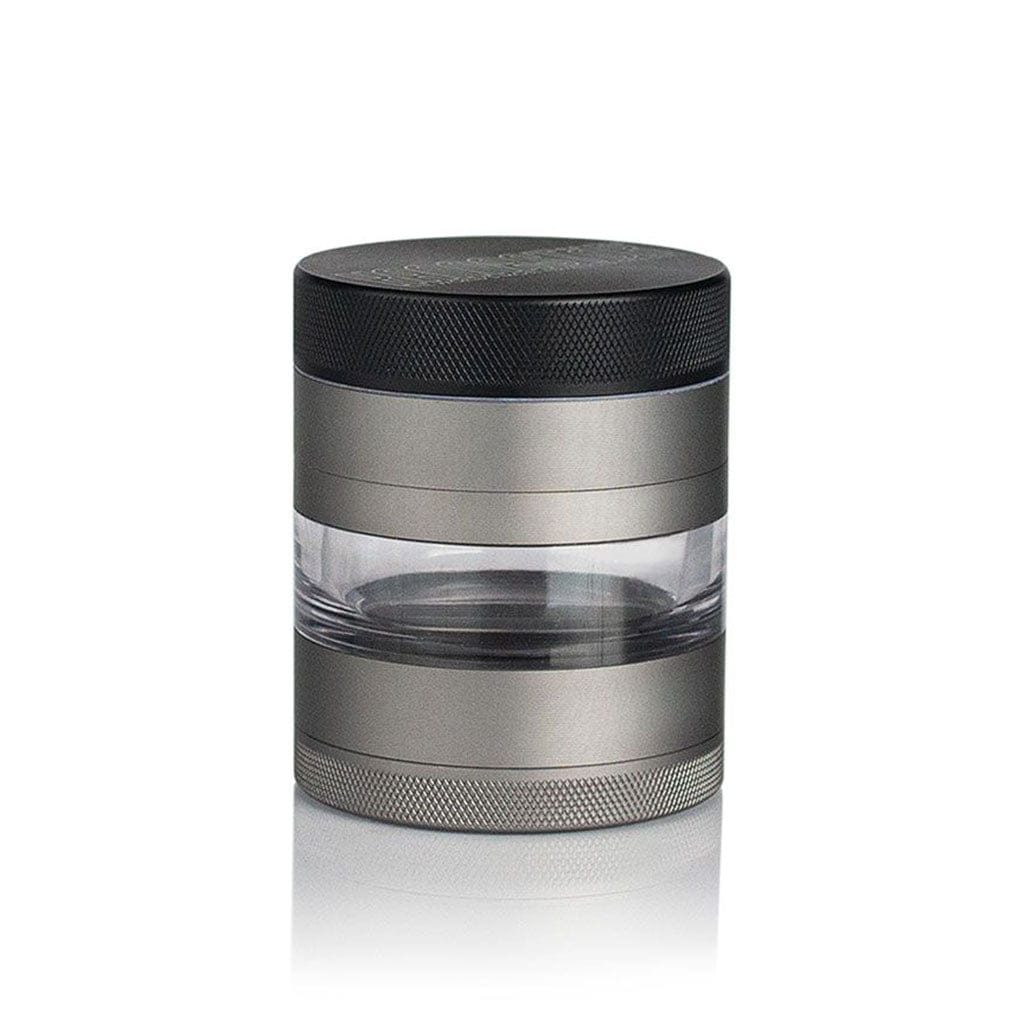 Centered studio shot of the Ryot 4Pc Jar Body Grinders showing its stacked metal and clear acrylic cylinder with textured black top and silver bands.