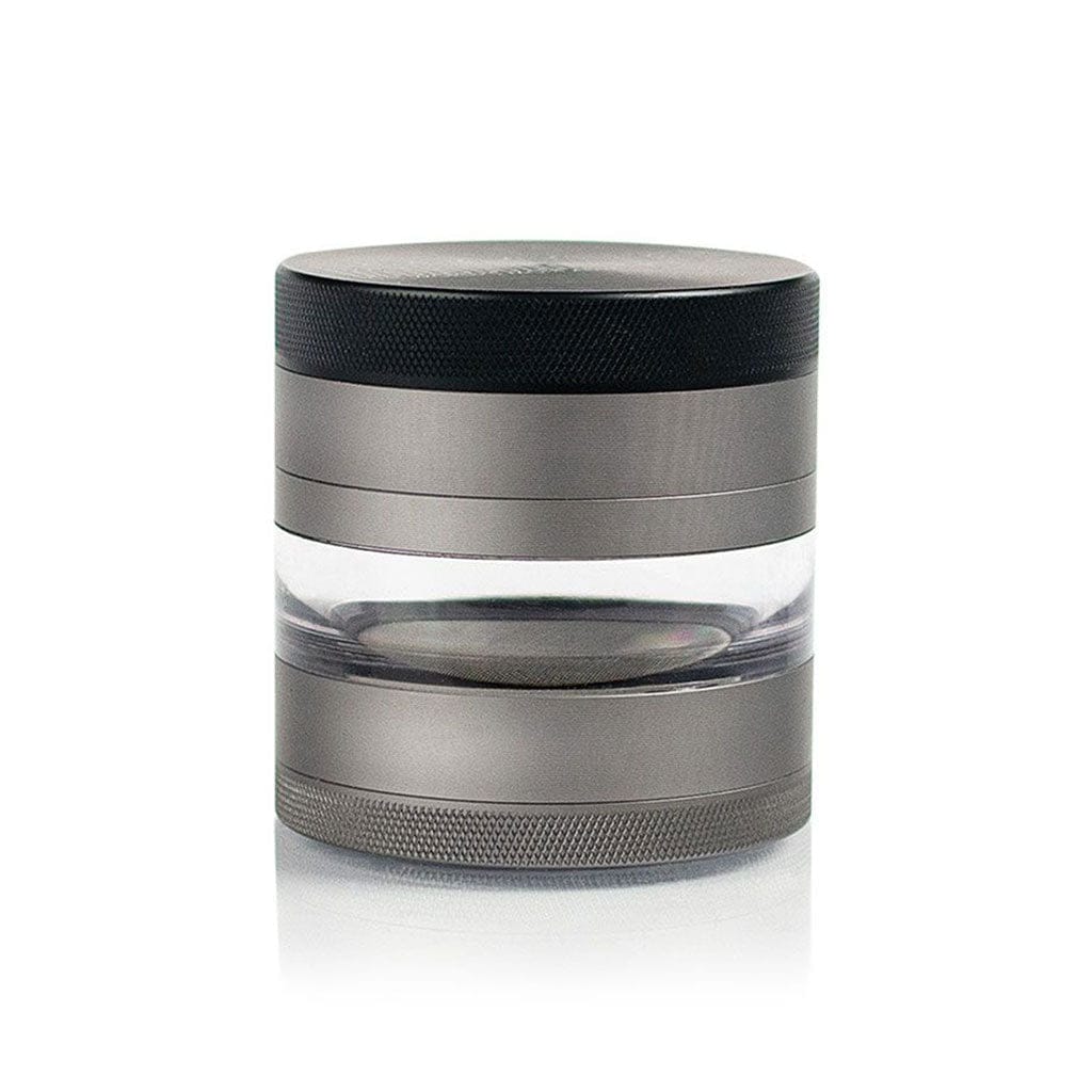 Straight-on studio shot of a silver and black Ryot 4Pc Jar Body Grinders showing textured lid and base with a clear middle chamber.