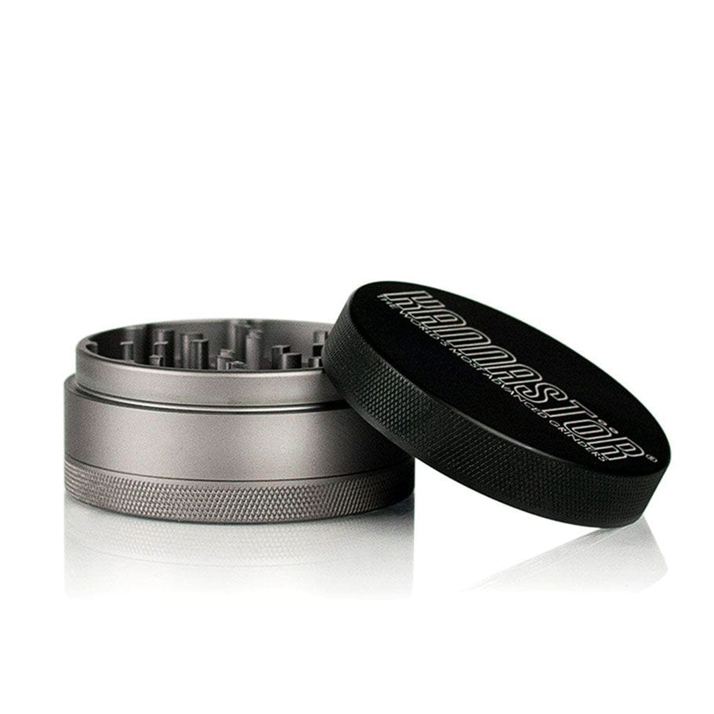 Angled close-up of the open Ryot 4Pc Jar Body Grinders showing its metallic silver chamber and black textured lid with logo.