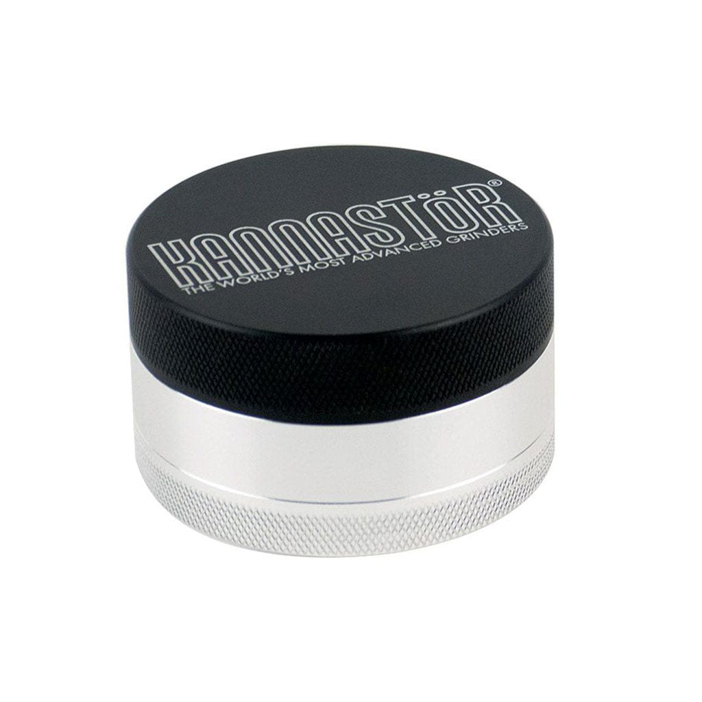 Angled close-up of the Ryot 4Pc Jar Body Grinders showing a black knurled lid with white logo atop a silver cylindrical body on a white background.