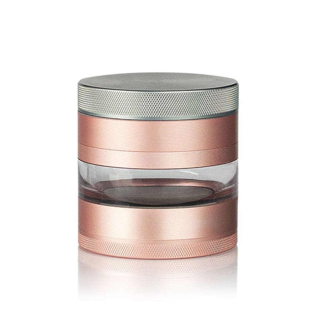 Studio-style front view of the Ryot 4Pc Jar Body Grinders in rose gold with a clear middle chamber on a white background