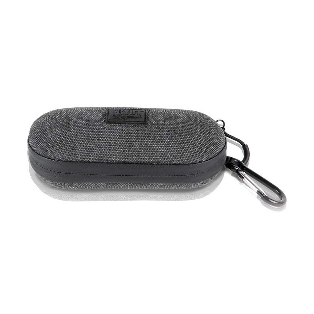 Front view of a gray fabric Ryot Hardcase with rounded edges and a side carabiner clip, shown on a white reflective surface