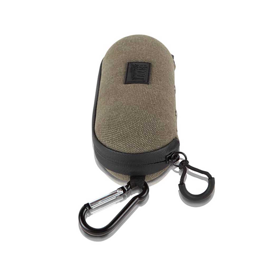 Top-front angled view of a compact Ryot Hardcase in olive fabric with black trim, showing the zipper, carabiner clip, and textured logo patch.