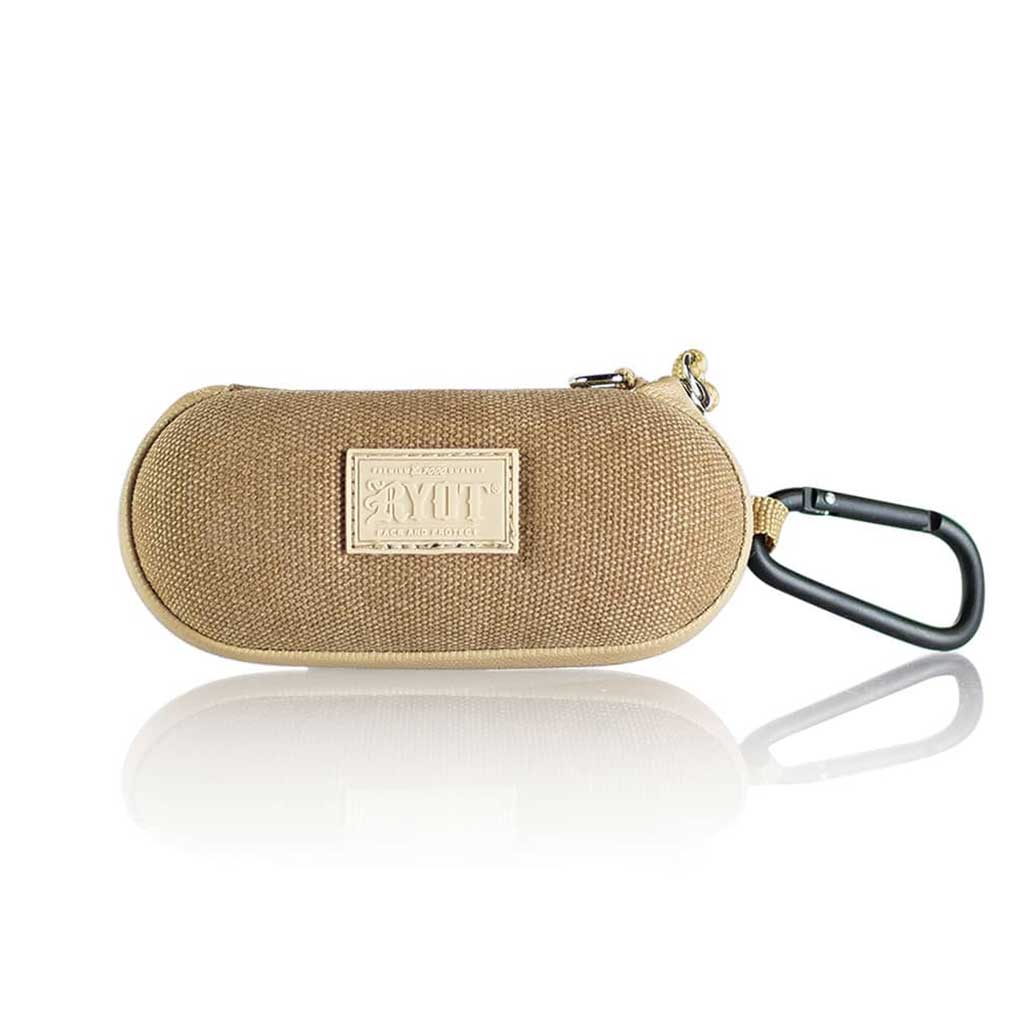 Front-facing shot of the tan Ryot Hardcase with woven texture, visible logo patch and attached black carabiner reflected below.