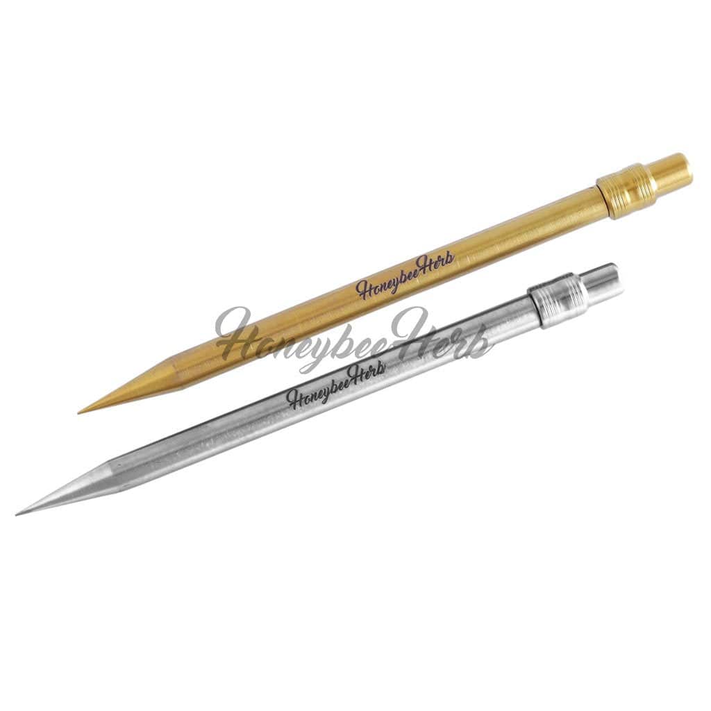Diagonal top-down view of two metal pencil-style tools, one gold and one silver, with "Honeybee Herb Titanium Pencil" printed along their shafts.
