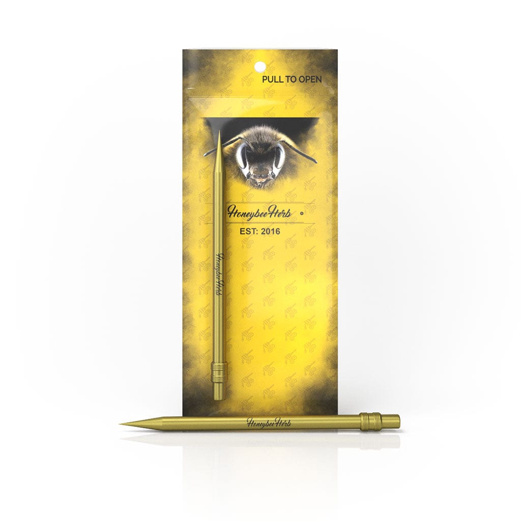 Front-facing product shot of the Honeybee Herb Titanium Pencil in metallic gold against its yellow branded backing with a bee illustration.