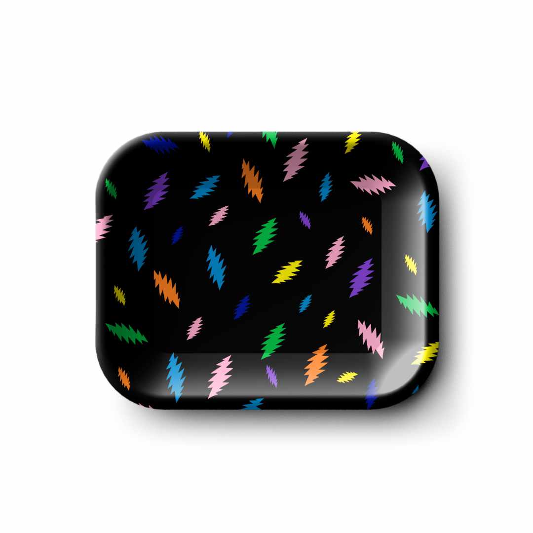 Top-down view of the Blazy Susan Grateful Dead Metal Rolling Tray - Small with a glossy black surface scattered with colorful jagged lightning-like shapes.