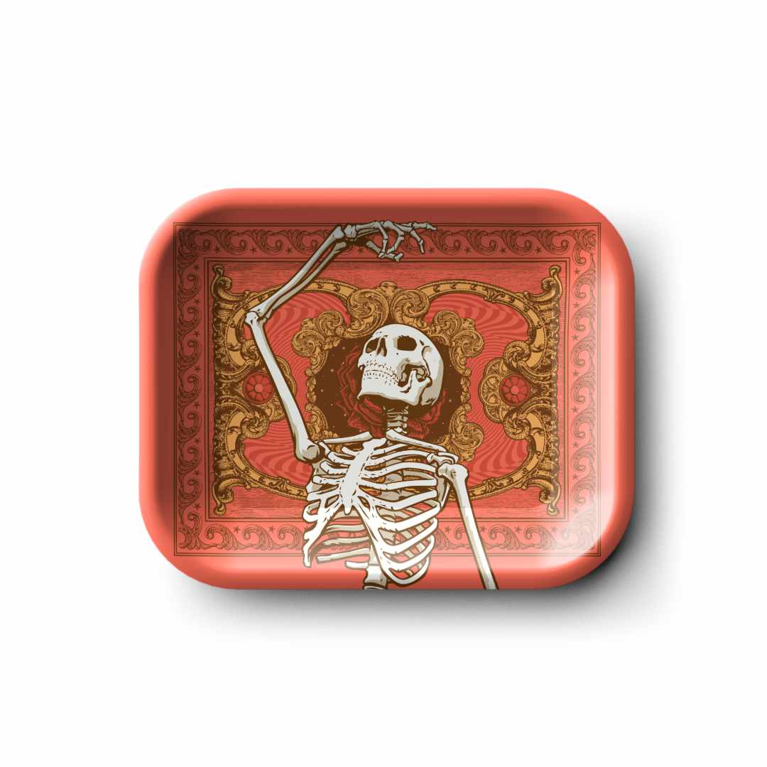 Top-down view of the Blazy Susan Grateful Dead Metal Rolling Tray - Small showing a white skeleton reaching up against a red ornate background.