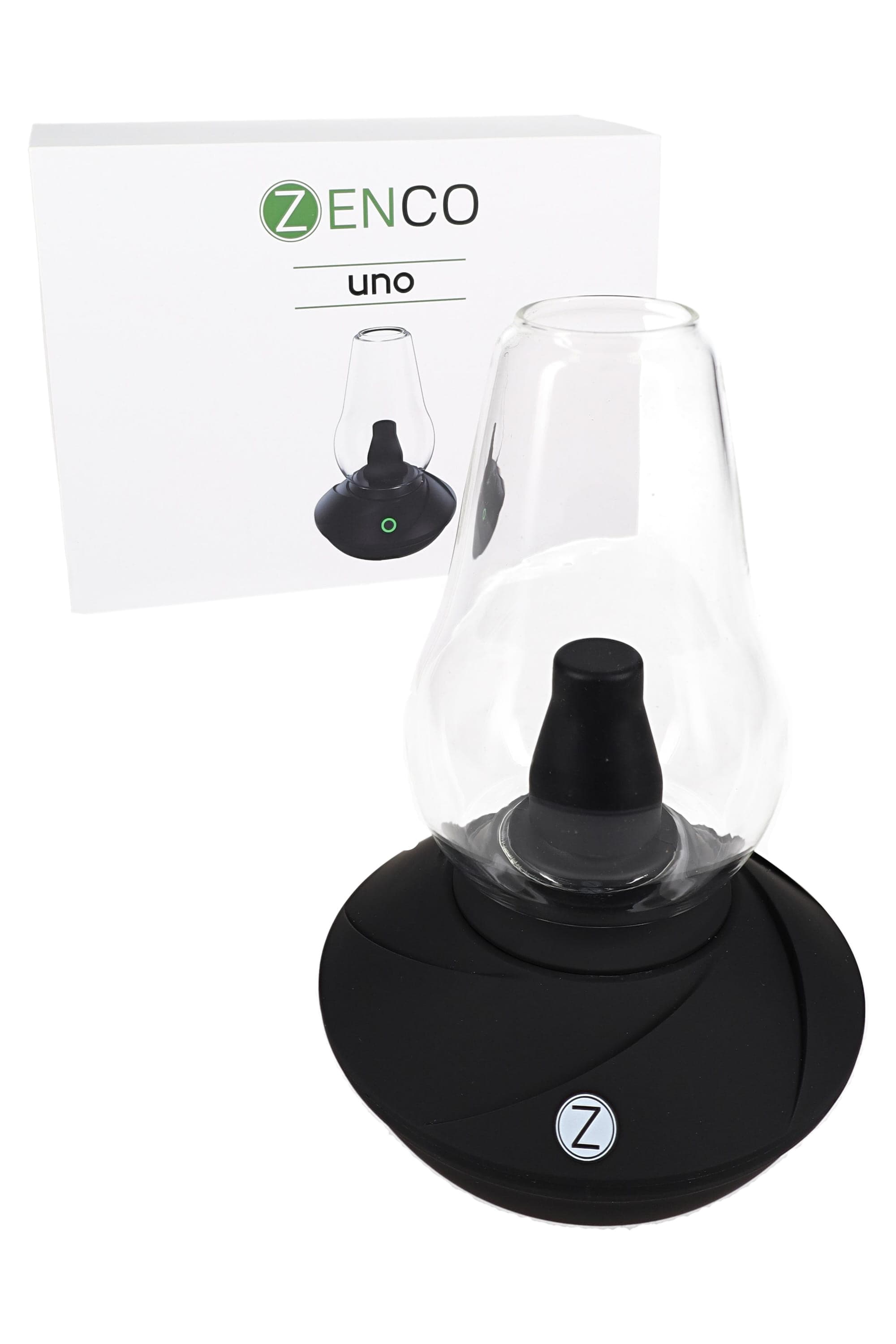 Close-up angled view of the black Zenco Uno Desktop Vaporizer – Auto-Fill Glass – 4 Heat Settings showing its glass chamber, black base with a Z logo, and the product box in the background