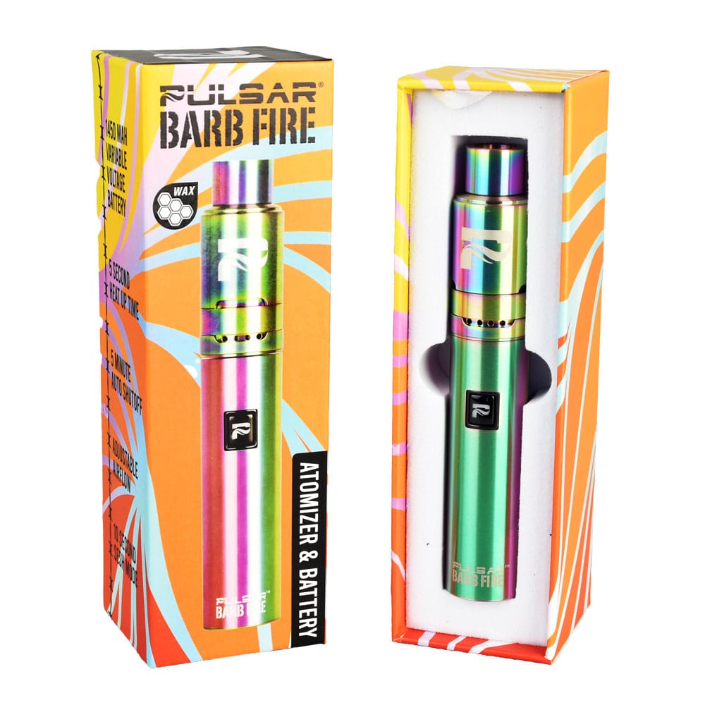 Front-facing shot of the rainbow-finish Pulsar Barb Fire Variable Voltage Wax Vaporizer nestled in white foam next to its orange and teal printed box.